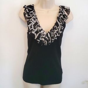 White House Black Market  Black knit top with ruffle.  Size  M New never worn.